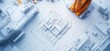 © VINA - Overhead view of a construction site with a crane and white models of buildings on blueprints.