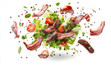 Fresh salad topped with crispy bacon and cherry tomatoes on a white background