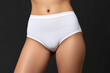 © Vladislav - Promotional photo featuring a mockup of white women’s briefs panties on a clean, minimalist background. Ideal for showcasing lingerie design, fabric texture
