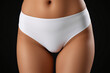 © Vladislav - Promotional photo featuring a mockup of white women’s briefs panties on a clean, minimalist background. Ideal for showcasing lingerie design, fabric texture