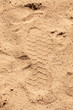 © Vera Aksionava - This is a close up view of a pile of sand with visible footprints in it