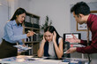 © PaeGAG - Business colleagues arguing and blaming stressed businesswoman during a late night meeting in office, concept of mobbing, stress at work and bad work environment