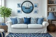 © Michael - Comfortable white sofa with blue cushions in nautical style living room