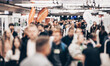 © kasto - Abstract blurred people at exhibition hall of expo event trade show. Business convention show or job fair. Business concept background