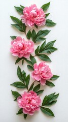 Wall Mural - Pink peonies with lush green leaves arranged neatly on a light background