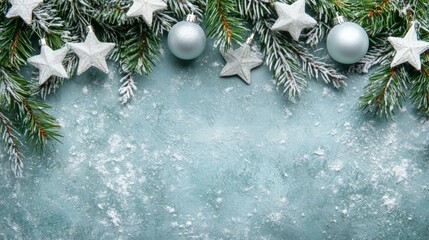 Wall Mural - Snow-covered Christmas tree branches with white balls on blue background, creating festive winter scene.