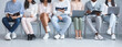 © Prostock-studio - Cropped photo of young diverse people with laptops and books sitting in line, waiting for job interview, panorama