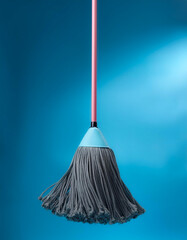 a mop bucket floating or flying isolated on light blue background