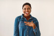 © Prostock-studio - Positive Emotions Concept. Portrait of excited African American woman smiling, laughing and looking at camera, touching chest. Emotional young black female curvy model standing isolated on white wall