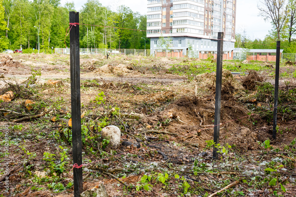 Installing metal fence posts around a construction site Stock Photo ...