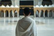 © mohdfaizal - Traditional Pilgrim in White Clothing at Sacred Site
