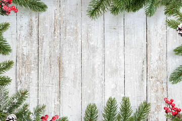 Christmas background. pine leaves Christmas decoration on white wood plank. Merry Christmas and New Year holiday background. top view frame border design.