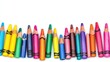 © SETSU NART - Top view of open crayons and art supplies on white background, vibrant theme with room for Children Day message