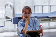 © David - Medical nurse is on bed in hospital sitting down a the hospital corridor in frustration and grief after failure and patient body condition