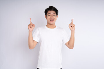 Portrait of an Asian guy posing on a white background