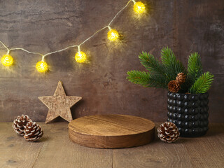 empty wooden log podium on table with christmas decorations over lights garland background. christma
