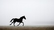 © Thamonchanok - Horse running gracefully in a misty landscape, captured in motion.