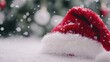 © LensDreamer - Santa cap with fluffy pom-pom on a white background, close-up.