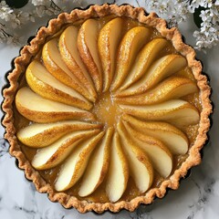 A beautifully arranged pear tart with a golden crust and fresh pear slices.