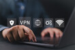 © Nirusmee - VPN, Virtual private network protocol concept. Person use laptop with VPN icon on virtual screen for connect to VPN network.