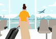 © Westend61 - Woman with suitcase watching plane taking off at airport