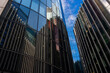 © yaqui_villegas - A captivating image of a curved glass building displaying intricate reflections of neighboring structures, blending urban architecture with artistic visual interplay  in London UK