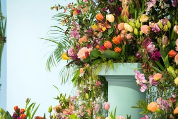 Wall Mural - Elegant Floral Podium Display Featuring Vibrant Spring Blooms for Event Decor