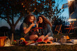 © Halfpoint - Couple having romantic picnic during camping trip in nature. Caravan traveling for young people.