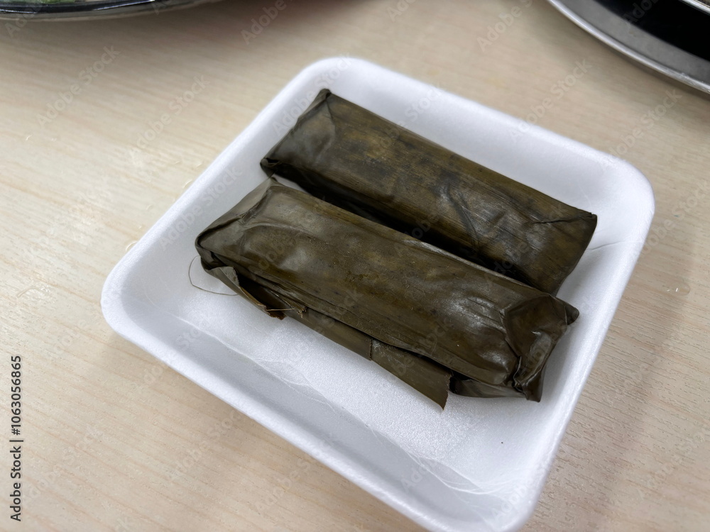 Spring rolls wrapped in banana leaves. Vietnam street food. Vietnamese ...