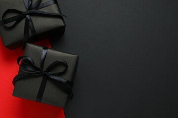 Beautiful gift boxes tied with bows on two tone  background 