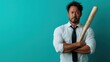 © Maximages  - An assertive man holding a bat stands confidently against a bright blue backdrop, wearing a white shirt and tie, portraying readiness and strength.