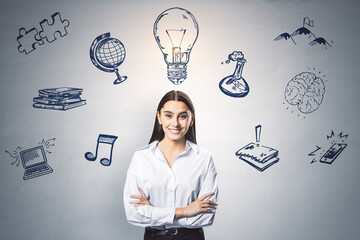 Canvas Print - Portrait of happy young european businesswoman with business sketch on concrete wall background. Success, innovation, idea and technology concept.