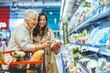 © Dragana Gordic - Two Women Shopping Happily Together in a Grocery Store