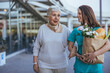 © Dragana Gordic - Caring Nurse Assisting Elderly Woman With Groceries Outdoors