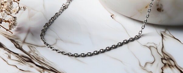 Delicate Silver Chain Bracelet on Marble Background
