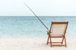 © ItziesDesign - Fishing chair with rod on a serene beach, calm water in the background.