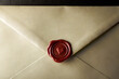 © Olga - Romantic letter seal on a cream envelope with red wax heart for love and affection