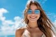 © neatlynatly - A woman in a bikini and sunglasses smiles joyfully outdoors under a vibrant blue sky. The image exudes a cheerful and carefree summer vibe.