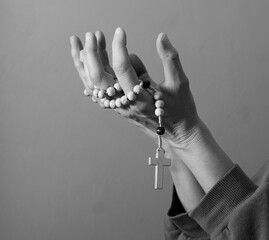 praying to god with hands together on grey background with people stock photo stock image	