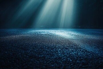 Wall Mural - a dark blue background with rays of light shining down on an empty asphalt road, creating a dramatic