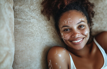 Portrait of a young African woman with vitiligo smiling