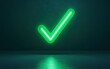 © Wan - A glowing green checkmark illuminated against a dark background, symbolizing approval or completion.