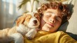 © Dulemegapixel - An adolescent boy rests with a dog on a couch, both asleep under a gentle, calming light, creating a peaceful, intimate moment captured in a warm, homely setting.