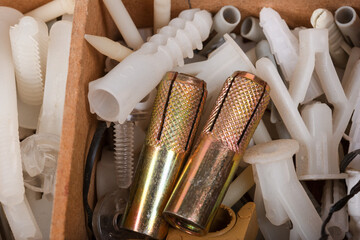 Organized Wooden Compartment Box Filled with Various Hardware Items, Screws, Bolts, and Metal Parts - Mechanic's Storage Solution on Dark Background