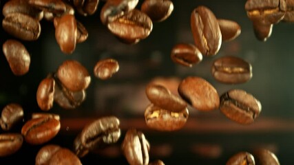 Aufkleber - Super Slow Motion of Falling Coffee Beans. Filmed on High Speed Cinema Camera, 1000 fps. Blur Kitchen Industrial Interior on Background.