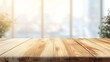 © Suleyman - Simple wooden table against a blurred Christmas background.