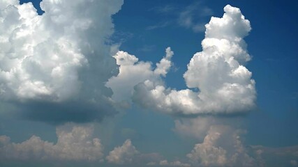 Wall Mural - time lapse of bluish gray and white thunderstorm clouds building in blue sky