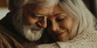 © HelgaQ - Elderly couple embracing in a warm, cozy moment of love and contentment