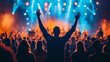 © MacAttack Creations - silhouette of man raising hands at concert with crowd and bright stage lights