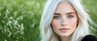 © Wall - A woman with white hair and blue eyes in a field